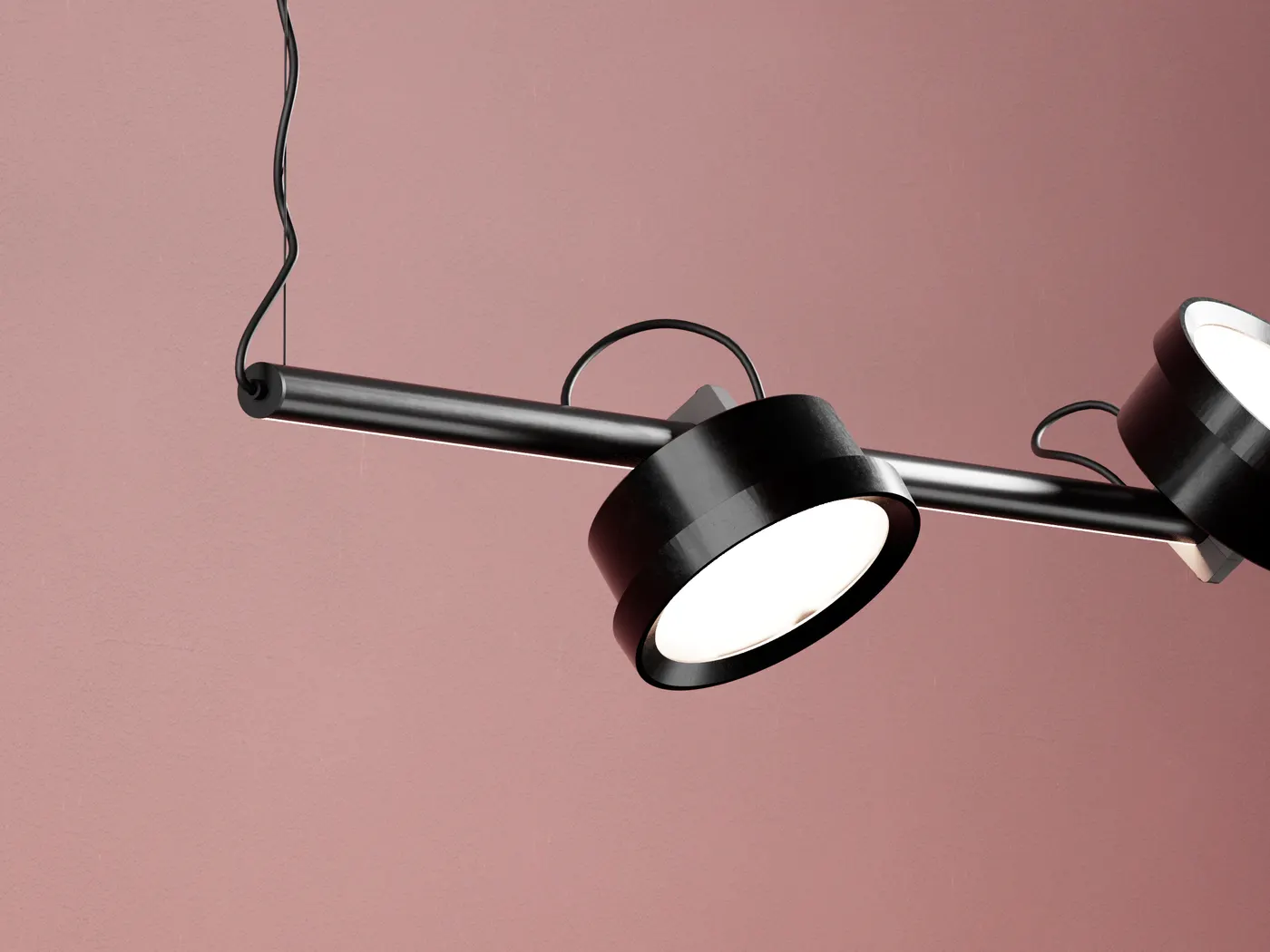 Zwarte Genuit-pendel met twee ronde spots voor een roze wand
